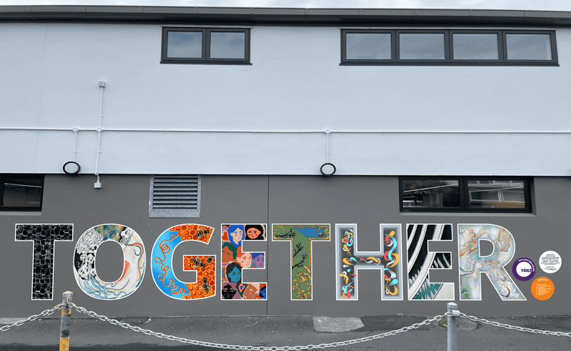TOGETHER mural on the side of Shore Junction